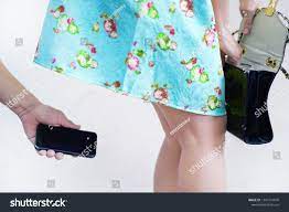 Стоковая фотография 1303774870: Closeup Abuit Hand Taking Upskirt Photos |  Shutterstock