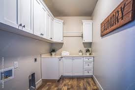 Laundry Room Interior With Cabinets And