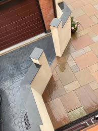 coping stones with rendered wall