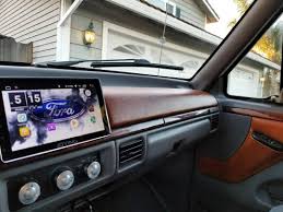 We restored interior door panels and refreshed rear and front seats. New Headunit And Vinyl Wrapped Part Of The Dash And Doors Thinking Of Painting The Interior Black Sometime In Ford Trucks F150 Ford Diesel Diesel Trucks Ford
