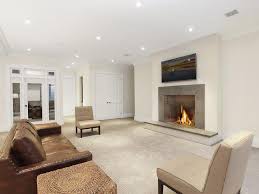 Beige Basement Tv Room With Fireplace