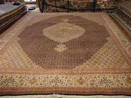 tabriz fish design persian rug