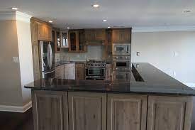 gray knotty alder cabinets kitchen