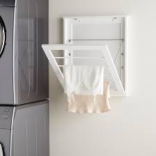 The triangle on the rope stops it from being flush with the roof, but is necessary for stability. Wall Mounted White Wooden Drying Rack The Container Store