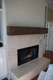 natural stone tile fireplace with wood