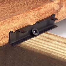 How to fasten a wood stud wall from a garage, shed or other building to a concrete pad. Choosing Deck Fasteners Connectors