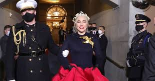 Not only was lady gaga rocking a giant dove broach that resembles the famous mockingjay from the hunger games, but. Who S Behind Lady Gaga S National Anthem Outfit