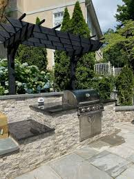 With stone, brick, and other exterior options, these grills offer form and function with options for extra burners, storage, and more. Outdoor Kitchen Designs Installation J J Landscape Management Inc