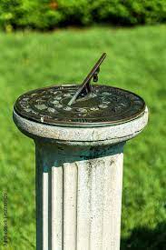 Antique Sundial On A Pedestal In Sunny