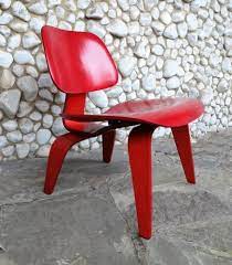 stained red lcw lounge chair by charles
