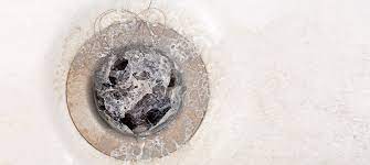 how to remove a shower drain cover