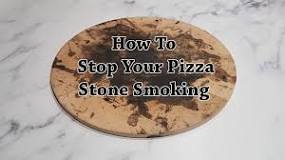 Why is my pizza stone smoking?