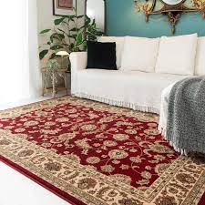 traditional red motif bordered rug