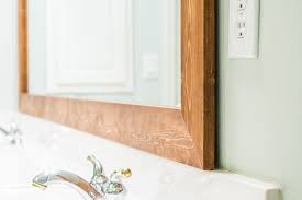 Here's an easy way to transform your bathroom mirrors by framing them. How To Diy Upgrade Your Bathroom Mirror With A Stained Wood Frame Diy