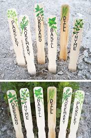 Such a great idea and a cute addition to your garden, matches its surroundings and all it takes are some rocks and a few sharpies! Handmade Herb Markers Set Herb Signs Plant Markers Plant Labels Hand Painted Gift For Gardener Herb Markers Garden Labels Plant Markers