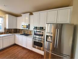 photos of repainted kitchen cabinets in