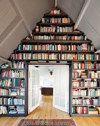 16 floor to ceiling bookshelves that