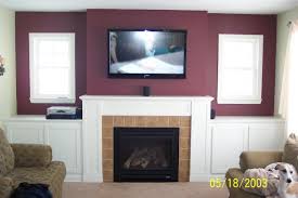 above fireplace mounted tv