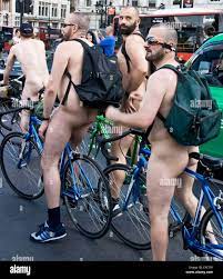 Nude naked nudist bare men male adult cyclists on world naked bike ride in  Trafalgar Square London England Europe Stock Photo - Alamy