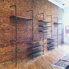 Shelving In Front Of An Exposed Brick