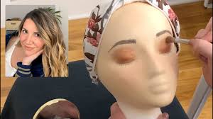 asmr applying makeup to styrofoam head