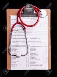 Medical Chart And Stethoscope Isolated On Black Background