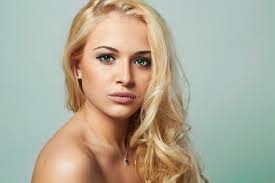 Natural lighter hair colors occur most often in europe and less frequently in other areas. Young Woman Beautiful Blond Girl With Green Eyes Curly Hair Stock Photo Image Of Blond Fresh 40828248