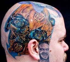 Pink roses and skull tattoo. Fantasy Robot Head Tattoo Ideas Tattoo Designs Bumble Bee Tattoo Special Tattoos Biomechanical Tattoo