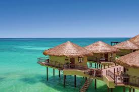 Overwater bungalow hotels in the caribbean. 8 Bucket List Caribbean Overwater Bungalows 2021