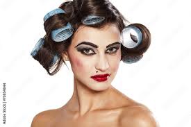 funny woman with curlers and bad makeup