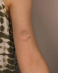fine line chrysanthemum flower tattooed