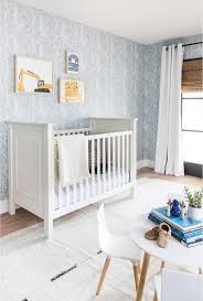 White Wooden Crib On Blue Nursery