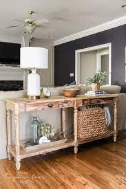 console table behind couch