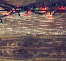 Colorful Christmas Lights On Wooden Rustic Background