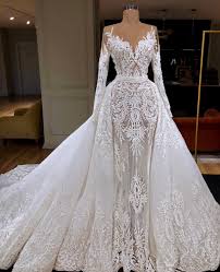 In the early 1900s, the most fashionable brides donned our collection of short and long sleeved wedding dresses includes a vast assortment of styles to suit every bride. Lace Long Sleeve Drape Shoulder Tight Bodice Cinched Waist Tulle Train Wedding Gown Wedding Dresses Bridal Dresses Bridal Gowns