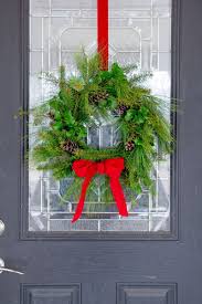 Simply hang the hook over your door, add your wreath and candle, and your done. How To Make A Fresh Greenery Wreath Wholefully
