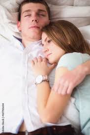 young love couple in bed lying on