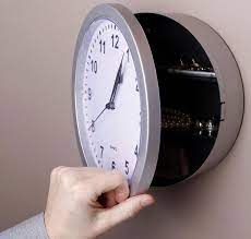 This Wall Clock Swings Open To Reveal A