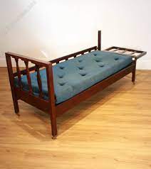 An Arts Crafts Mahogany Sofa Bed