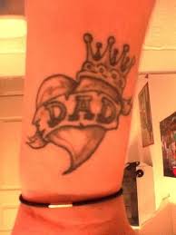 grey banner and heart crown tattoo