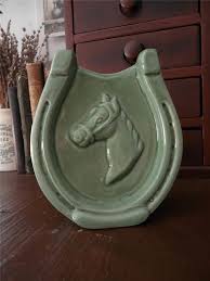 This wall would be a 'mere' 1,954 miles long.and probably cost more than the us can afford in the first place, it would probably cost more than the entire space program. Vintage Mccoy Horseshoe Wall Pocket With Good Luck On The Back Pottery Art Pocket Vase Wall Pockets