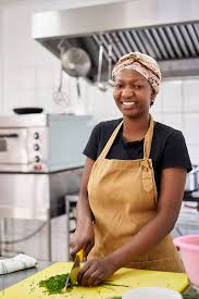 a female chef cook preparing food in a