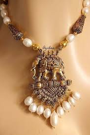 antique gold tone elephant pendant