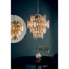 You must then perform the following step disassemble the brass plated light fixture according to the fixture's design. 12 Light Chandelier In Chrome With Champagne Crystal Decorations
