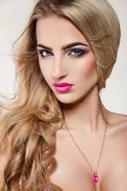 y blonde woman with makeup and blue