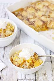 Learn how to layer ingredients and cook for a quick and easy dessert that's empty the cans of peaches with the syrup in to a 4 or 6 quart slow cooker. Easy Peach Cobbler Dump Cake Half Scratched
