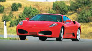 On the road, it commands. Ferrari F430 Buying Guide Evo