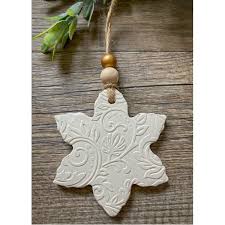 The snowflake decorations consists of three snowflake shaped ornaments that are hung onto to wall with string and wooden pegs. Christmas Decorations On The Hive Nz Sold By Snazzi