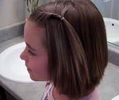 The shortness in the back makes it super easy to style and gives plenty of volume and texture whilst the longer lengths around the front give something to frame the face and experiment with little bits of style. Little Girls Hairstyles Front Twist Back For Short Hair Bangs Littlegirlhairstylesforshorthair Short Hair Ponytail Kids Hairstyles Short Hair With Bangs