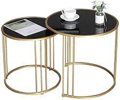 If you've got an, ahem, cozy living room, you may be considering skipping a coffee table altogether, but these options are functional and gorgeous, without completely taking over the space. Amazon Com Round Modern Nest Coffee Tables For Small Spaces Nesting End Tables Stacking Tables Glass And Metal Set Of 2 Black Furniture Decor